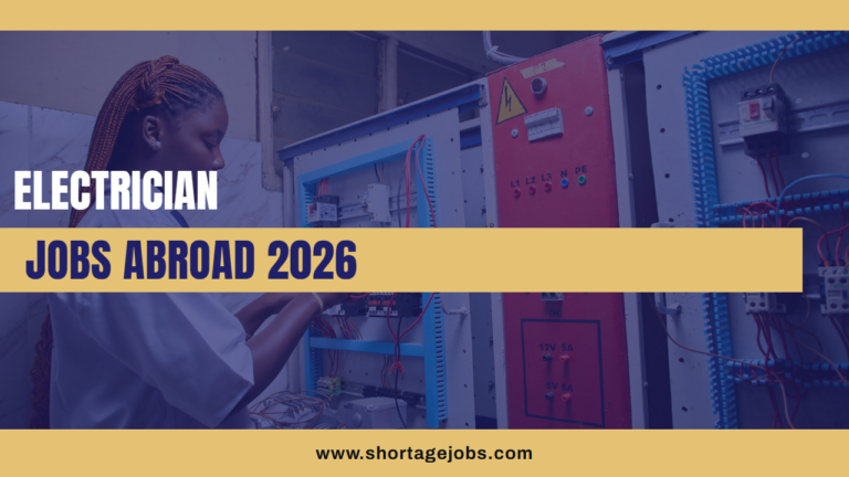 An electrician working on an industrial panel